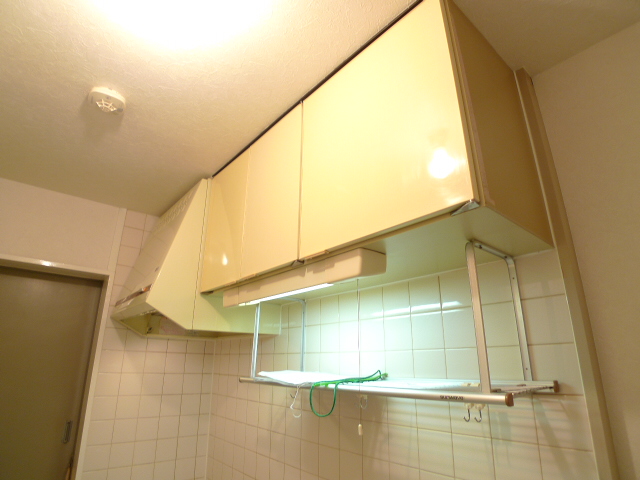 Kitchen. Kitchen around clean, with hanging cupboard