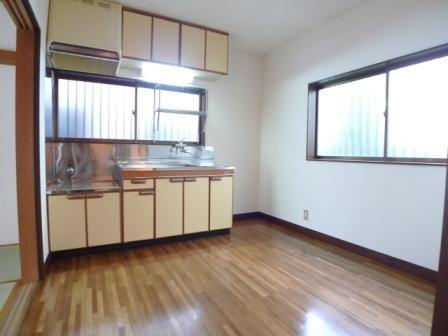 Living and room. There is space put the refrigerator in the kitchen next to