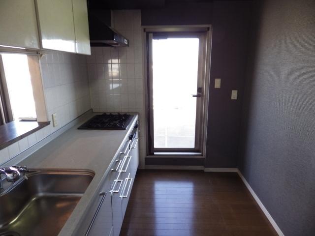 Kitchen. You can come out from the kitchen back of the door to the roof balcony.