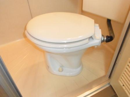 Toilet. Comfortable 3-point unit bus is clean