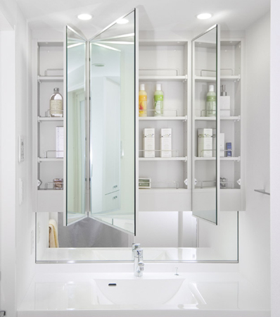 Bathing-wash room.  [Three-sided mirror with vanity (with indirect lighting)] The wide mirror was adopted vanity triple mirror type that was placed in the center. Ensure the storage rack on the back side of the mirror. You can organize clutter, such as skin care and hair care products.