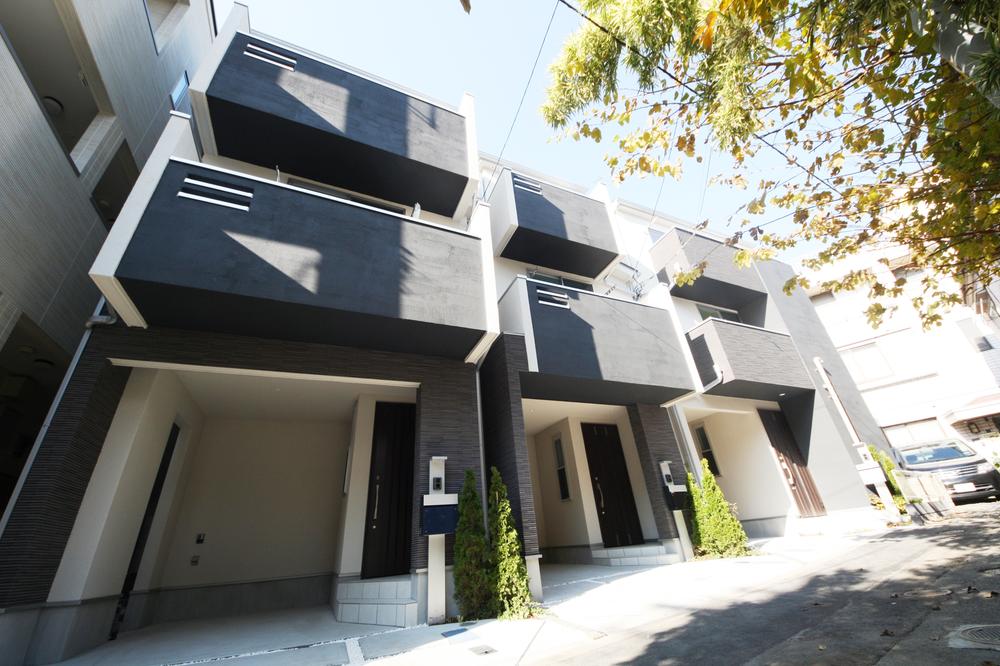 Local photos, including front road. Three buildings each different design, Floor plan