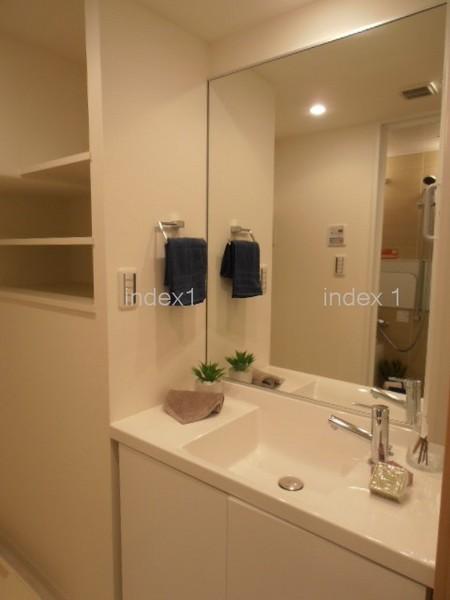 Wash basin, toilet. Vanity large mirror is happy