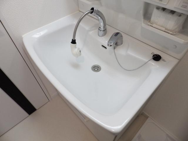 Wash basin, toilet. Wash basin is with a shower nozzle.