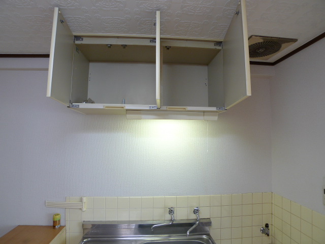 Kitchen. Hanging cupboard in the kitchen top will come in handy to tableware storage