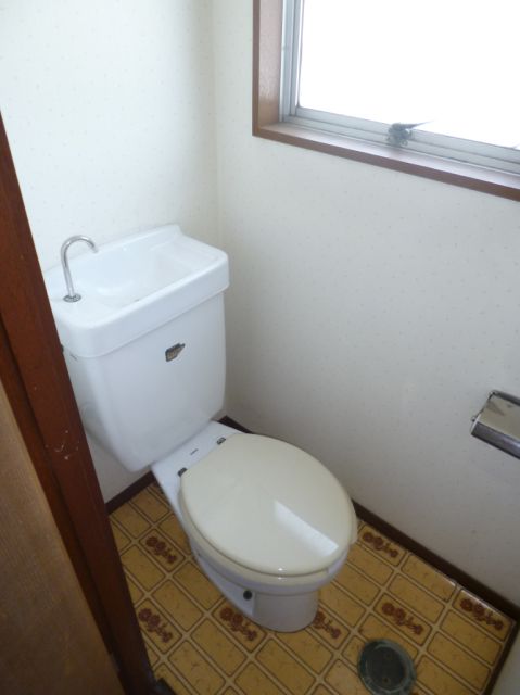 Toilet. Bright and there is a window! 