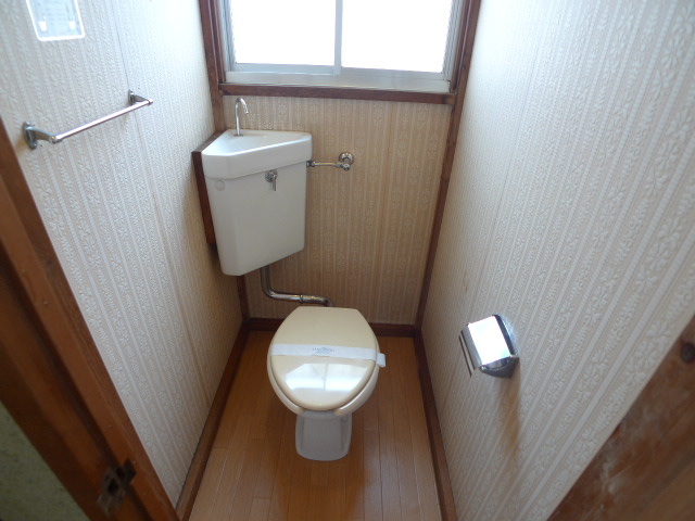 Toilet. Is good ventilation in the window with toilet