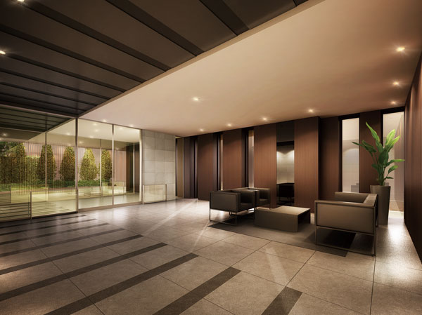 Features of the building.  [Entrance Hall of Yingbin full of grace] Adopt a visually indirect lighting with a calm. It is in the holes arranged sofa, Rather than the space of only passing, It sublimated to the relaxation of the scene. (Rendering)
