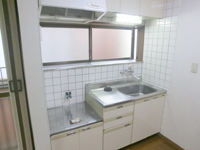 Kitchen. Kitchen with hanging shelves and windows.