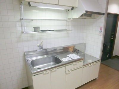 Kitchen. It is a kitchen with a hanging shelf. 