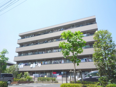 Building appearance. Thank south-facing sun per apartment on-site parking