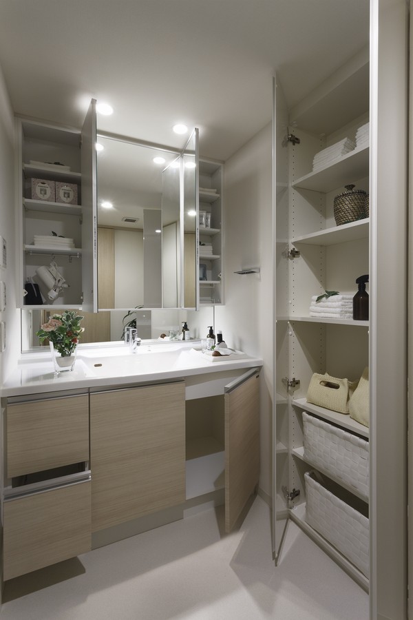 Three-sided mirror back with storage vanity and lavatory, which was installed such as two of the linen cabinet