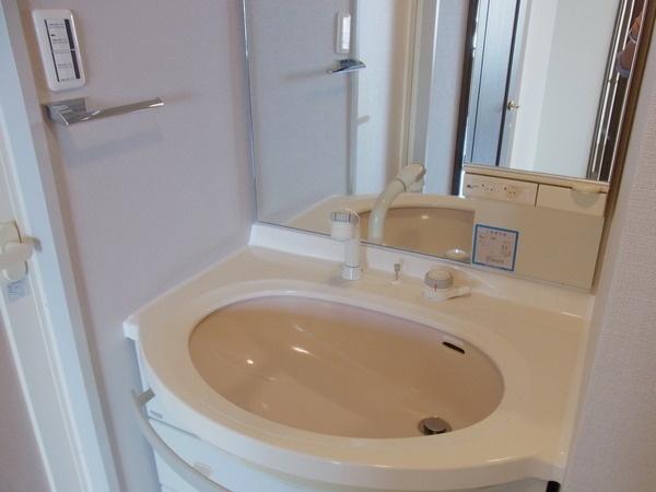 Wash basin, toilet. Shower