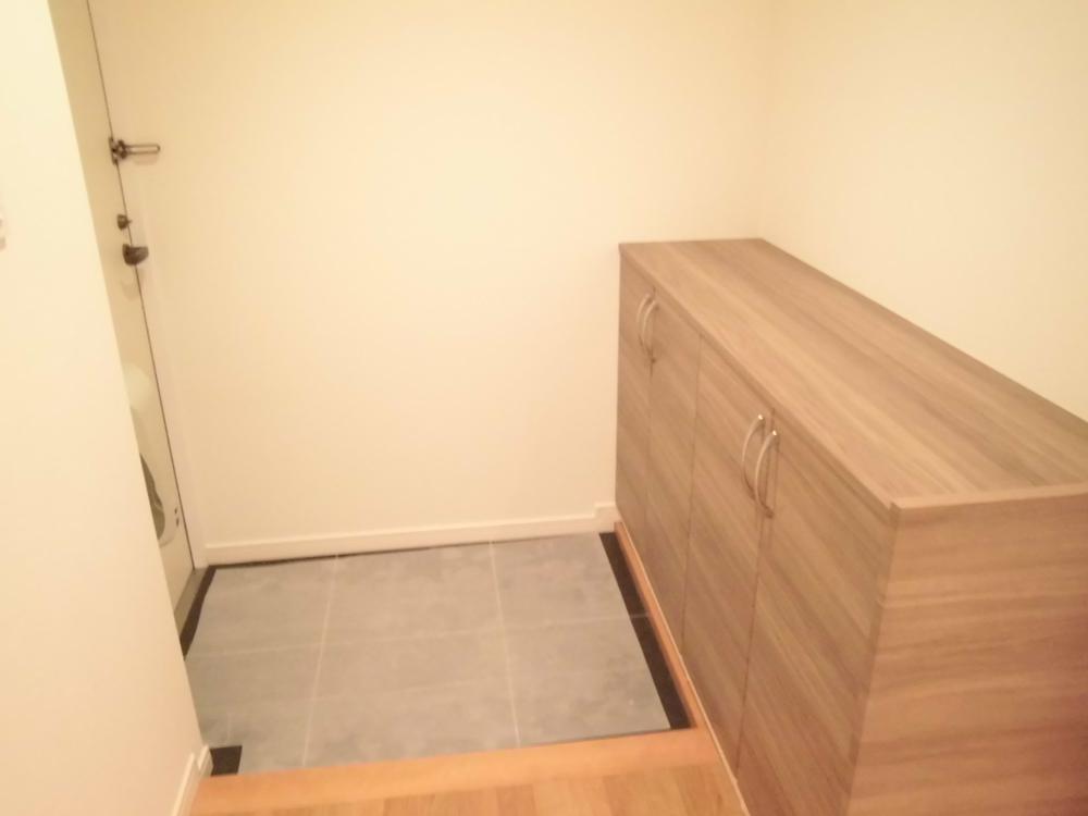 Entrance. It features a large shoe box