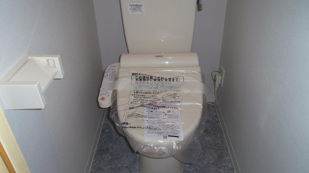 Toilet. Warm water washing toilet seat New is.