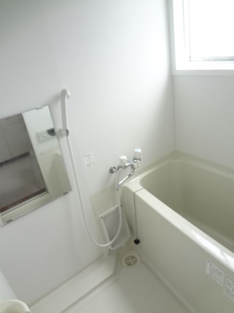 Bath. Bright bathroom and comes with a small window