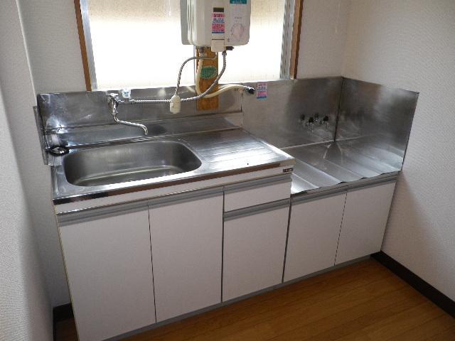 Kitchen. Gasukitchin there is a window with natural light