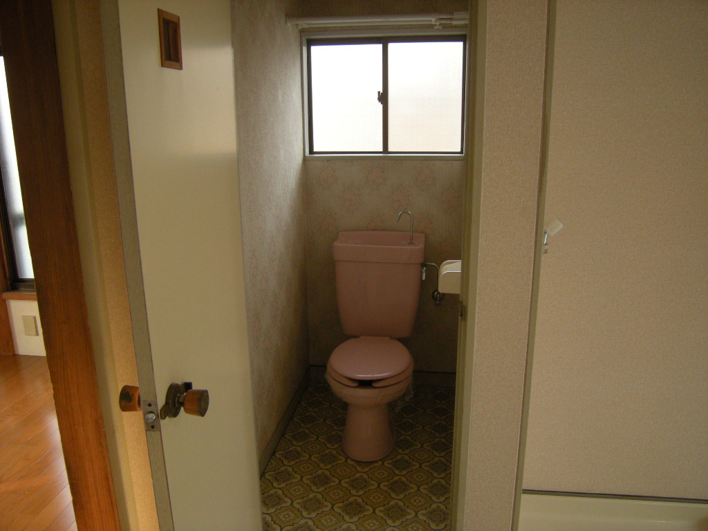 Toilet. There is a window