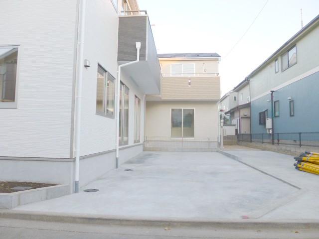 Parking lot. 1 Building of car spaces. Two parked are likely breadth
