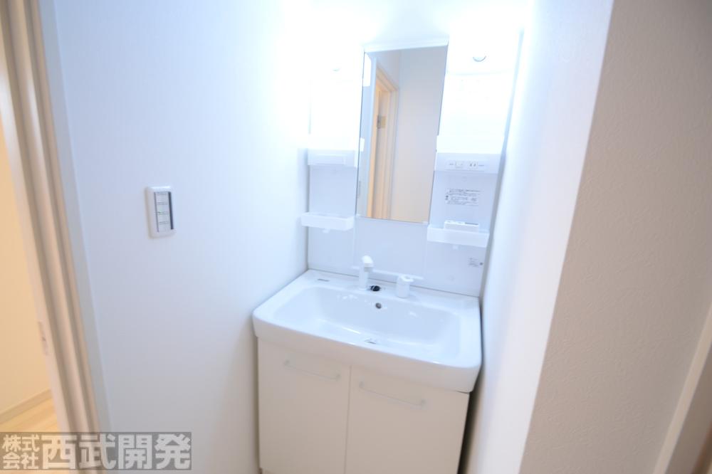 Wash basin, toilet. D Building