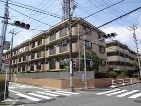 Building appearance. Appearance tiled apartment located in corner lot of the street