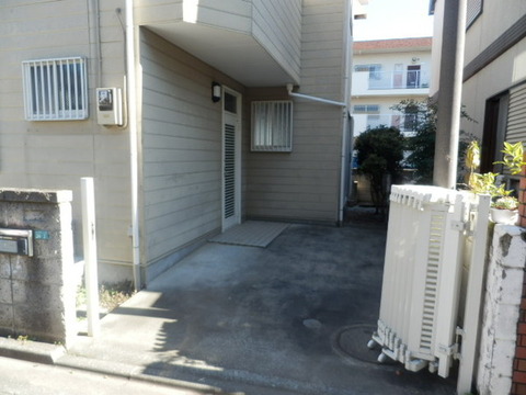 Parking lot. There is also a hand-washing water on the back side of the fence.