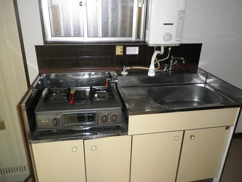 Kitchen. It comes with 2-neck gas stove with grill