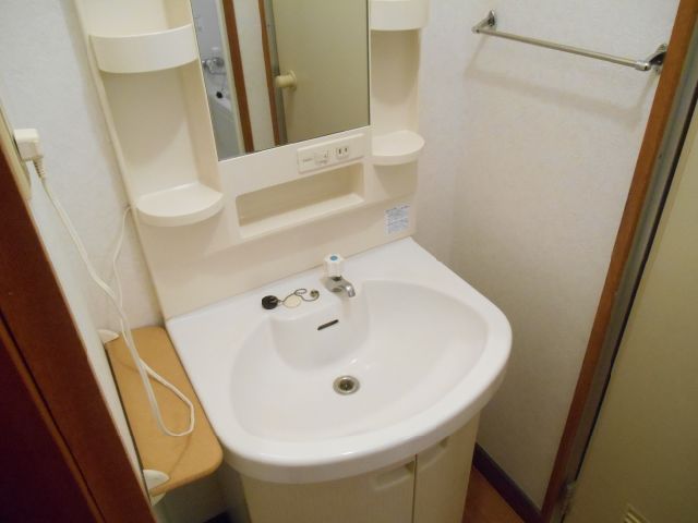 Washroom. It is with separate wash basin in the dressing room
