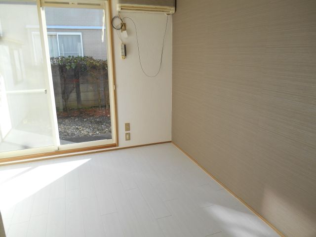 Living and room. White flooring accents cross pattern of brown