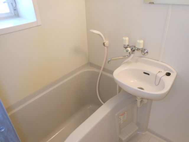 Bath. It is a bath with a wash basin