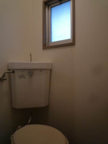 Toilet. There is a window in the toilet