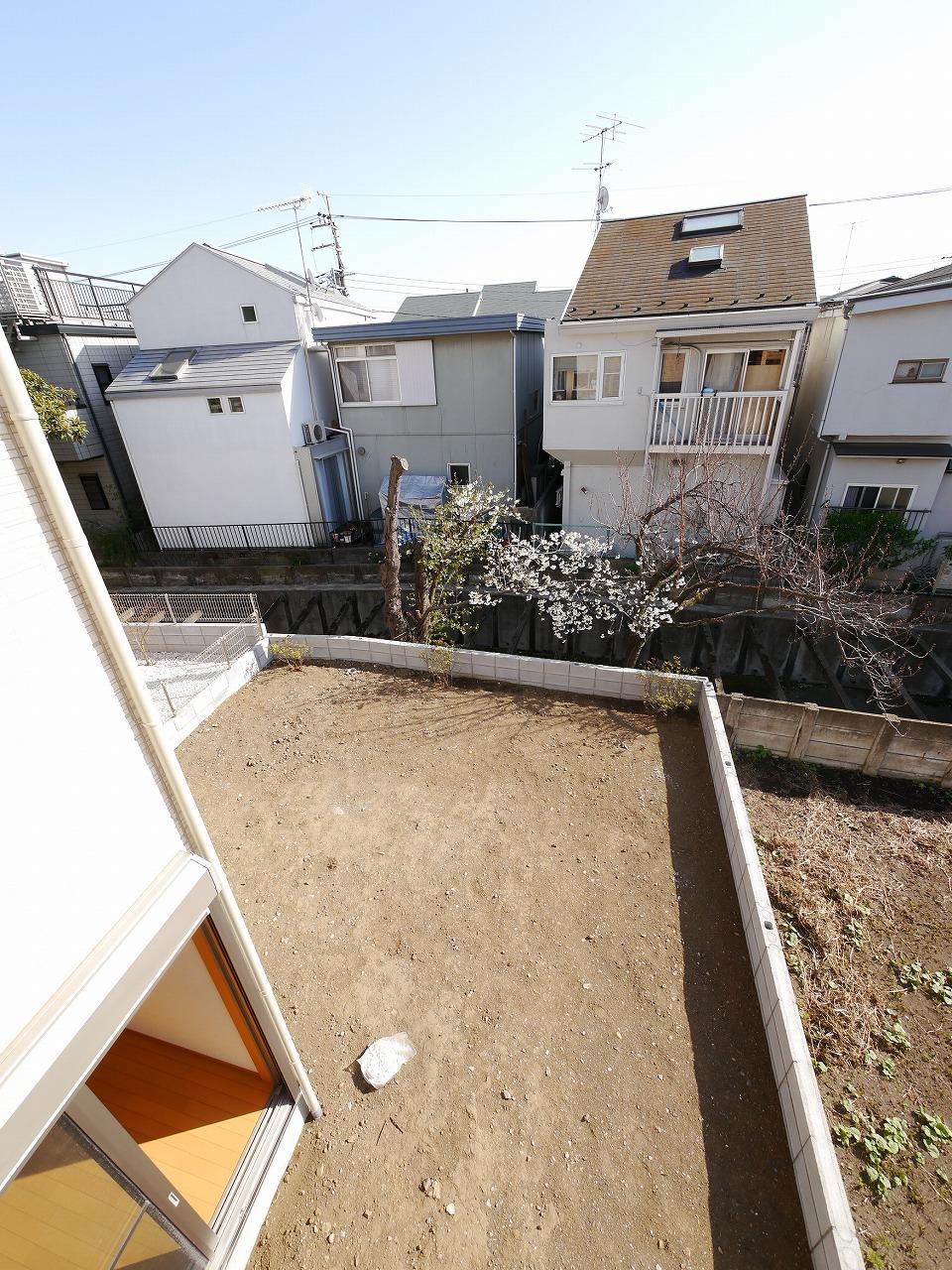 View photos from the dwelling unit. Overlooking the spacious garden from the second floor balcony