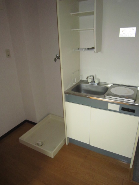 Kitchen. There is storage of built-in kitchen