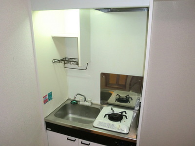 Kitchen. It is a gas stove with kitchen