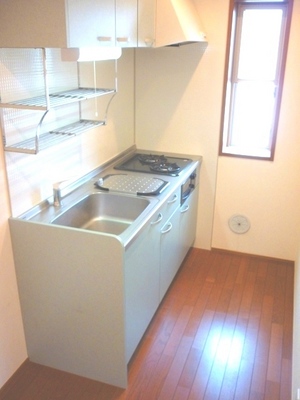 Kitchen. It is a photograph of a separate room of the same properties.