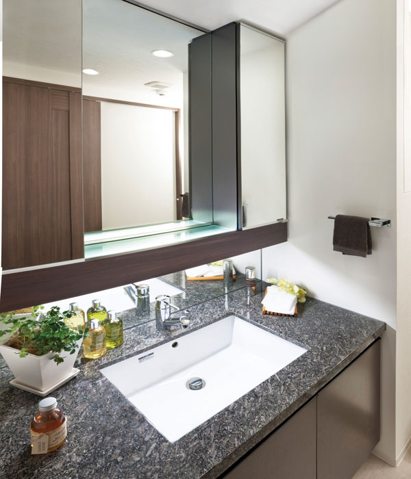 Bathing-wash room.  [Powder Room] By adopting the veneer to the vanity of the surface material, To calm a powder room in the quality space. LED lighting of the cabinet is, It illuminates gently the hand of the people live.