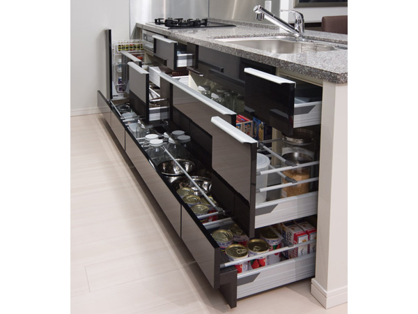 Kitchen.  [Sliding storage that can store plenty] Storage of system kitchens, It can be effectively utilized in the prone cabinet in a dead space, It has adopted a sliding storage.