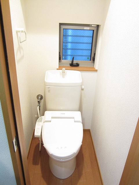 Toilet. There is a window in the toilet! 
