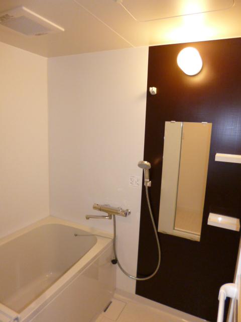 Bathroom. In refreshing impression bathroom, Panel of wood is accented.