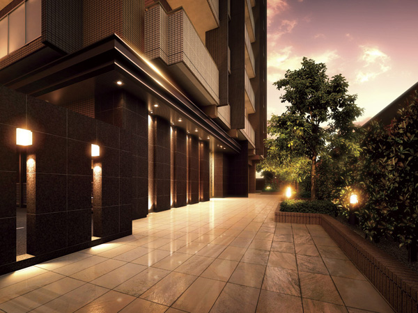 Buildings and facilities. Entrance wall of dark-based natural stone, Floor adopts the gray series of tile, We made a calm approach to harmony with the green. (Entrance Rendering)