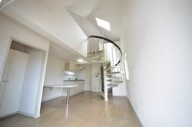 Living and room. Room with a spiral staircase