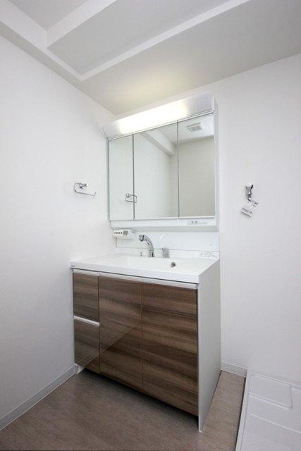 Wash basin, toilet. Noritsu made vanity is also replaced with a new