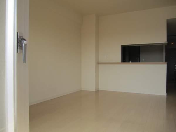 Living. It is clean because the carpet has been pulled in the flooring.