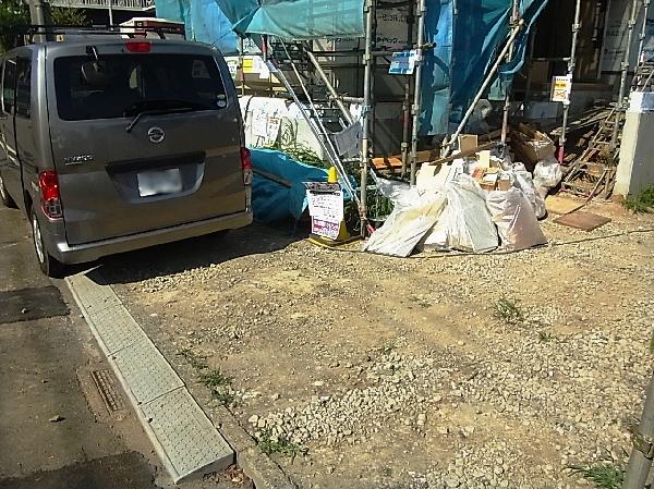 Parking lot. There is a car space for 2 cars.