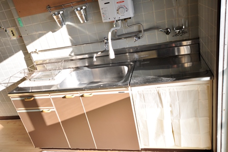 Kitchen. Two-burner is the stove is put sink. 