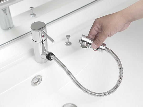Bathing-wash room.  [Single lever mixing faucet] Water and hot water is the single-lever type which are selectively used at the touch of a button.