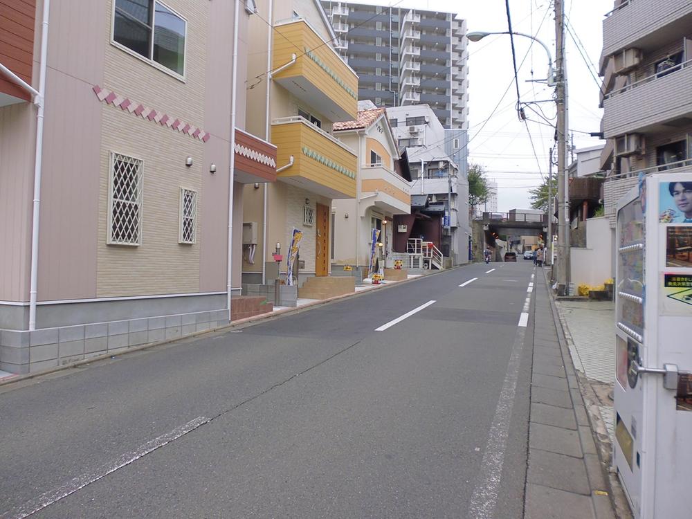 Local photos, including front road. 1 Building