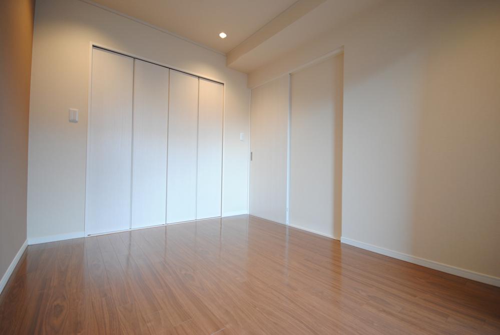 Non-living room. Walk-in closet with a bedroom