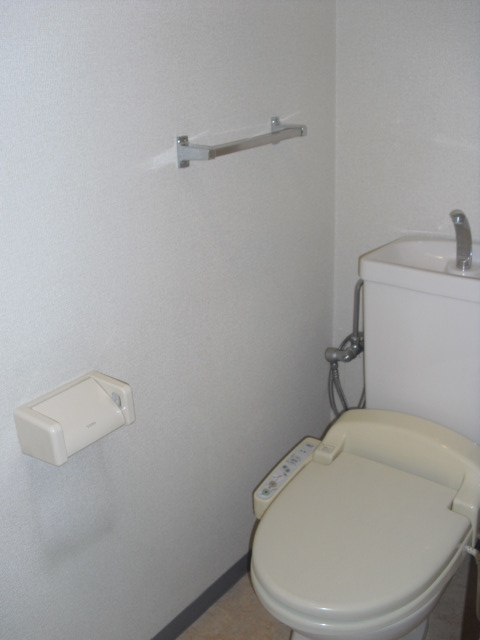 Toilet. It is a photograph of another in Room.