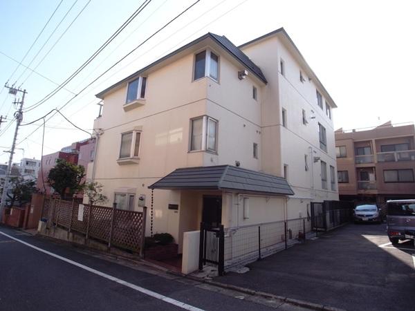 Local appearance photo.  [appearance] Low-rise apartment nestled in a quiet residential area.